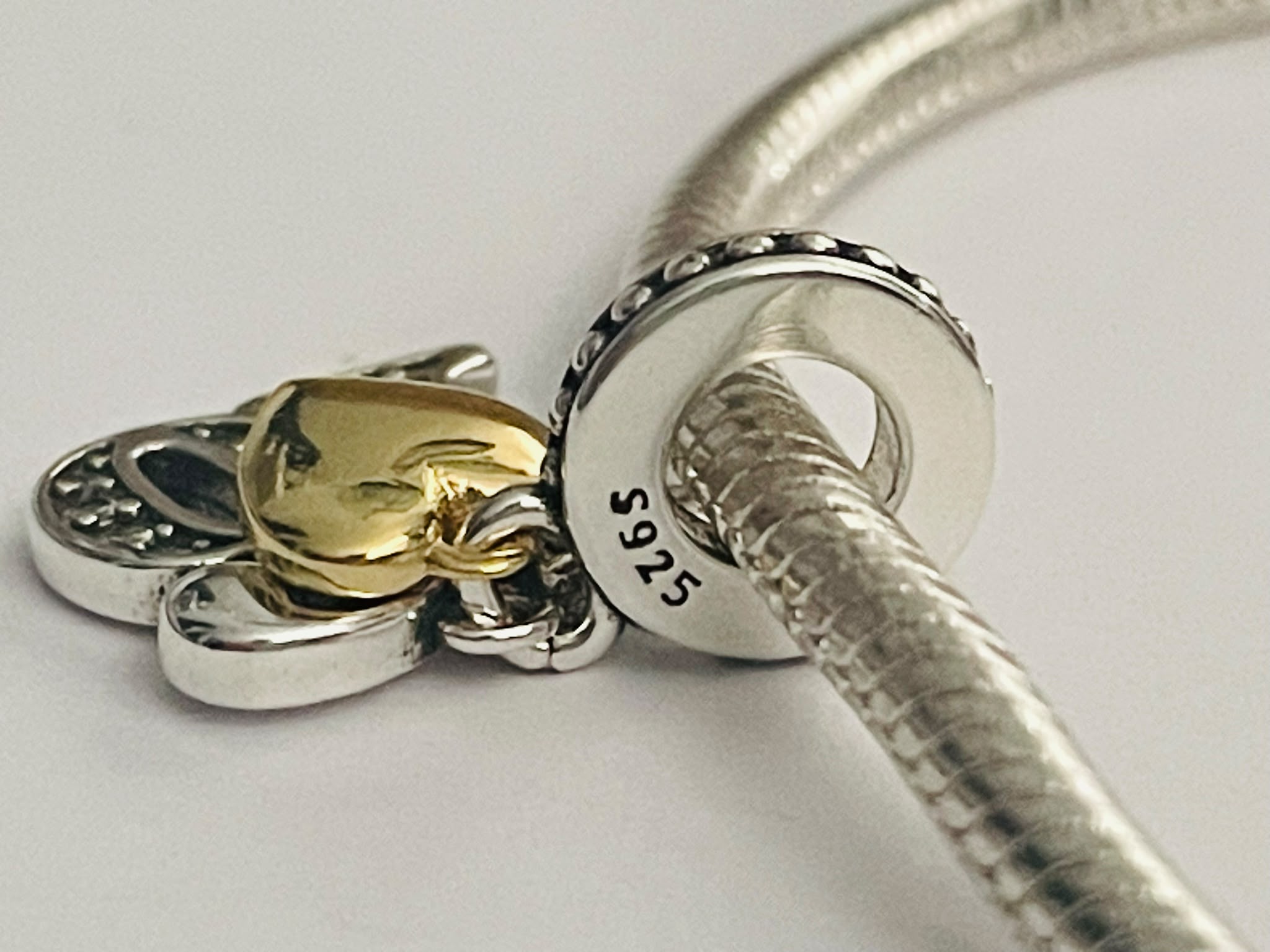 16th birthday charm back view on bracelet