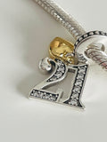 21st birthday charm with gold heart on silver bracelet