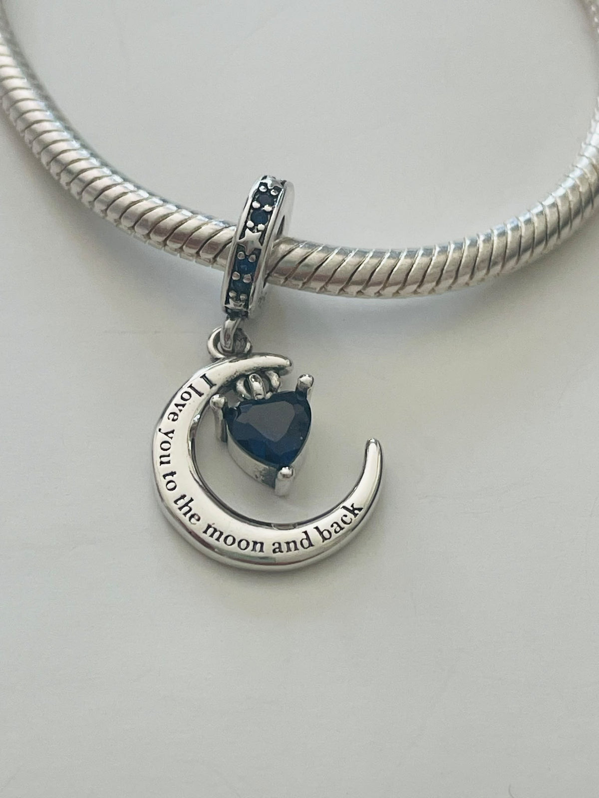 Moon and back charm front view on bracelet