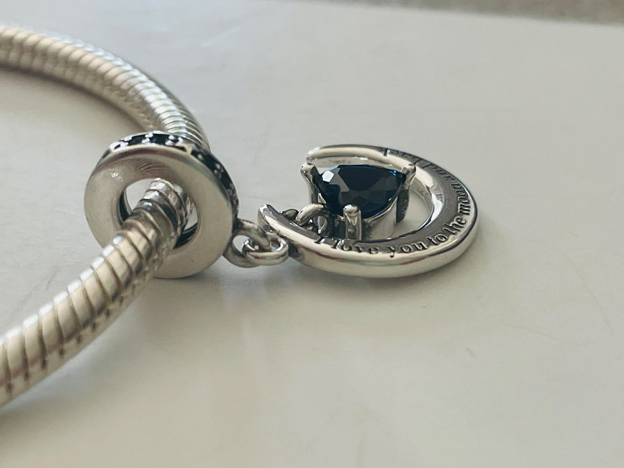 Moon and back charm close up side view