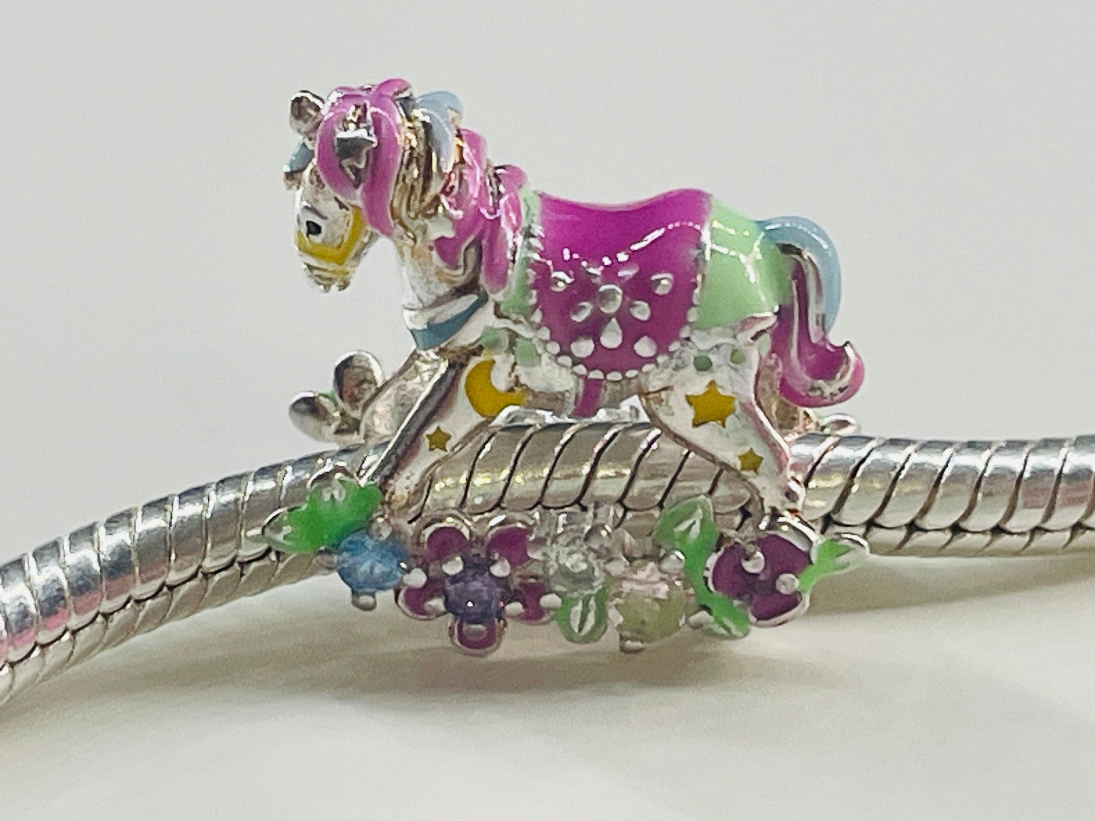 Rocking horse charm on bracelet close up